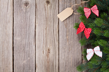 Christmas background with fir tree and bow decor