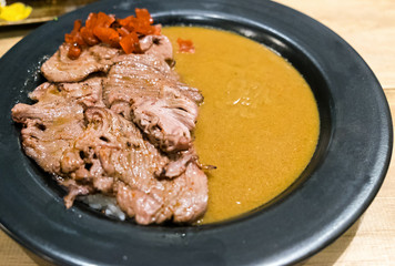 Japanese beef curry tasty in black plate