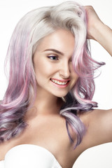 Obraz premium Young lady posing on white background. Beautiful hairstyle and hair color. Smiling face.