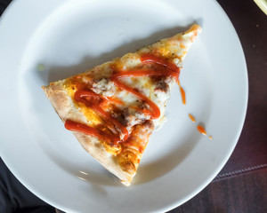 Pizza Italian sausage cheese topped with tomato sauce on white p