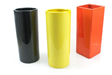 Three colorful ceramic vases isolated on white
