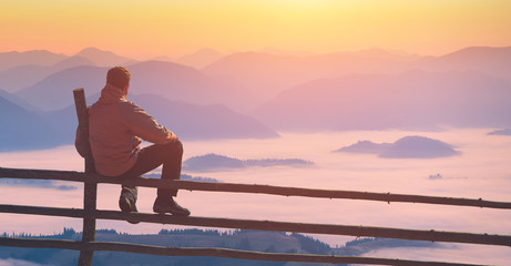 Man enjoy valley in a light of sunrise