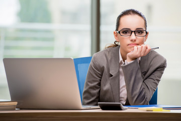 Fototapeta premium Sad businesswoman working at her desk