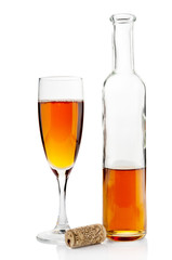 Wine bottle and goblet on white background