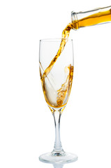 White wine pouring in wine glass