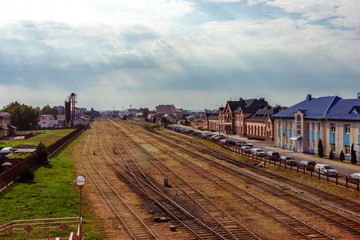 Fototapeta na wymiar Railroad tracks near the station building of Lida sity