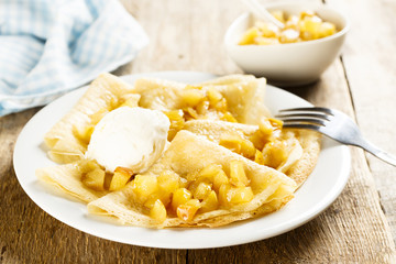 Pancakes with apple sauce and ice cream