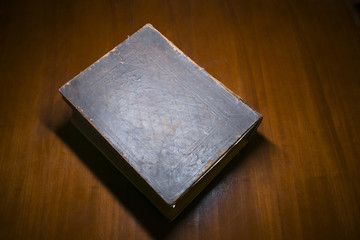 Fototapeta premium Old Book on a Desk