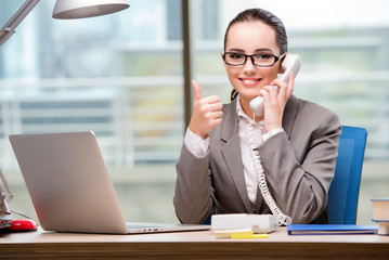 Call center operator working at her desk