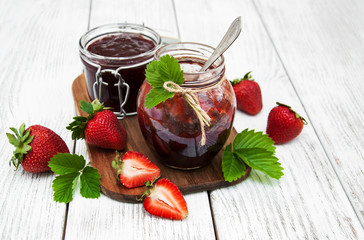 Strawberry jam and fresh strawberries