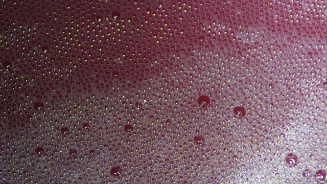 Fermenting must. Carbon dioxide is visible during the fermentation process in the form of bubbles in the must.
