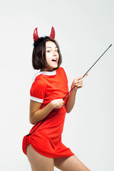 halloween sexy girl in devil antlers with stick