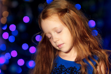Little girl near the Christmas tree. Christmas. New year's day.