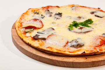 pizza on wooden cutting board