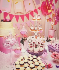 Tuinposter Sweet holiday buffet with cupcakes and meringues © lena_serditova