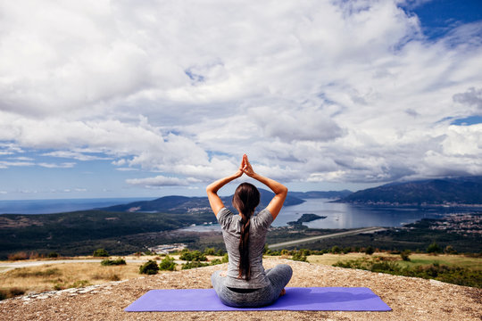woman yoga relaxation in serene landscape