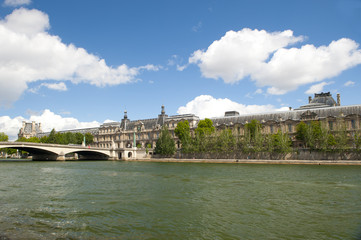 Summer view on louvre and sena in Paris