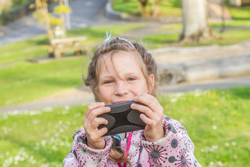 young happy girl taking selfie photos outdoors