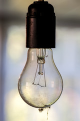Hanging dusty light bulb
