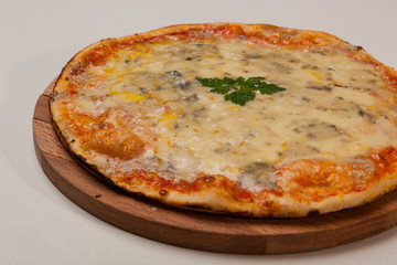 pizza on wooden cutting board