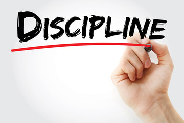 Hand writing DISCIPLINE with marker, concept background