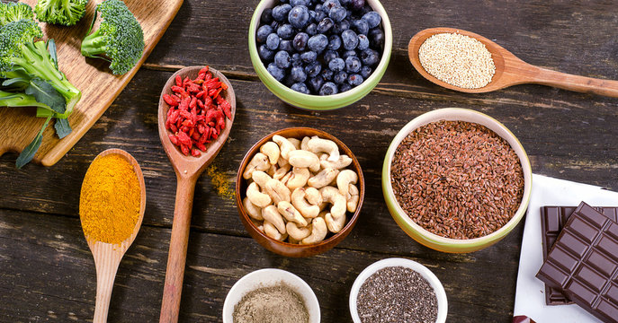 Super foods on a wooden background.