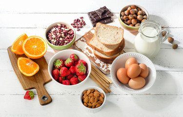 Allergy food concept. Allergic food on a white wooden background