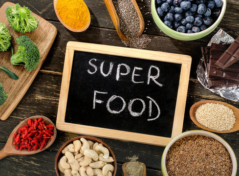 Super foods on  wooden background.