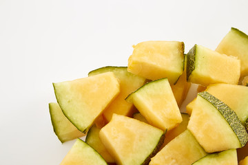 Hamigua Melon cut into slices, Hami Melon, Hami Cantaloupe isolated on white background.