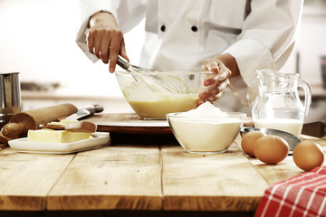 cook in kitchen interior 