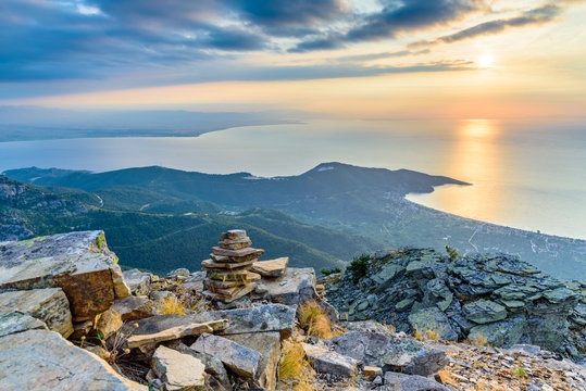 Spectacular sunrise at Thassos island, Greece, popular Greek island - tourist attraction, perfect vacation spot - view from a mountain top towards the bay of Kinira