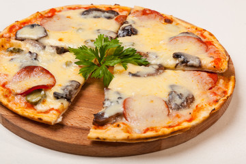 pizza on wooden cutting board