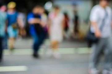 people in motion blur at the skytrain station