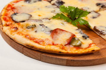 pizza on wooden cutting board