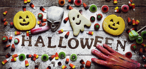 candies, cookies and word Halloween