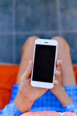 Closeup on business woman showing smartphone for social and internet projects. Gps navigation searching mockup technology