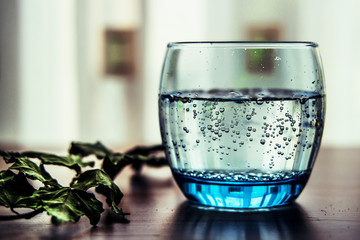 Pouring Mineral Water into the Glass.