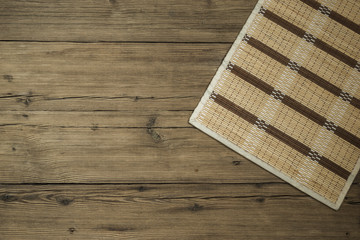 Wooden old background with braided napkin