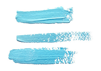 Three turquoise  light blue  strokes of the paint brush isolate - 121820085