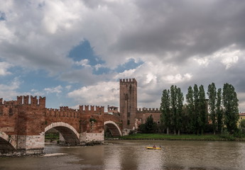 Beautiful photo of medieval stone bridge Ponte Scaligero built in 14th century near Castelvecchio. Verona, Italy.