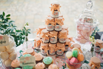 Assortie of the colorful sweets on the wedding table