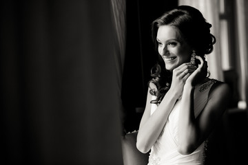 Black and white photo of the smile of the bride