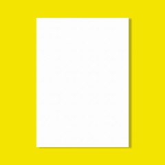 white paper sheet on yellow wall