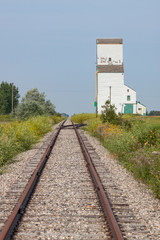Fototapeta na wymiar Railway Tracks Toward Distant Grain Elevator