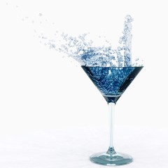 splash in a glass. water in a glass. wine is poured into a glass.
