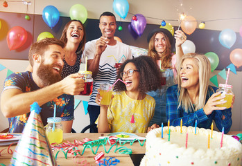 Happy exuberant group of friends celebrating