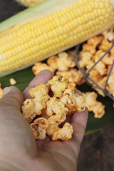 Popcorn with butter and fresh corn cob.