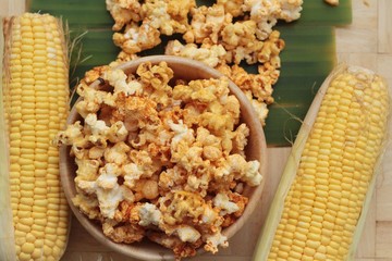 Popcorn with butter and fresh corn cob.