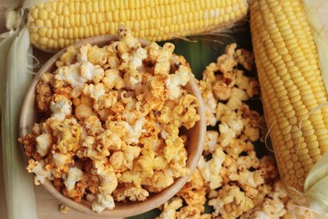 Popcorn with butter and fresh corn cob.