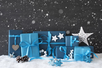 Blue Gifts With Christmas Decoration, Black Cement Wall, Snow, Snowflakes